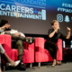 Warner Bros. recording artist Wale looks on while Jada Pinkett Smith talks about her path as an actress and content creator at the Careers in Entertainment summit on July 28, 2018, at UCLA.